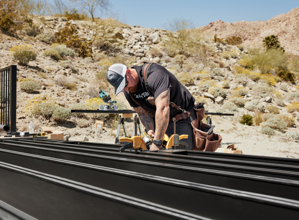 Worker installing TimberTech framing system.