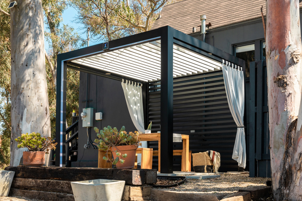 StruXure Cabana X system in a stylish outdoor setting, showcasing its modern design and functionality.